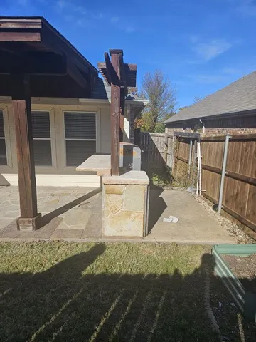 a view of backyard with green space