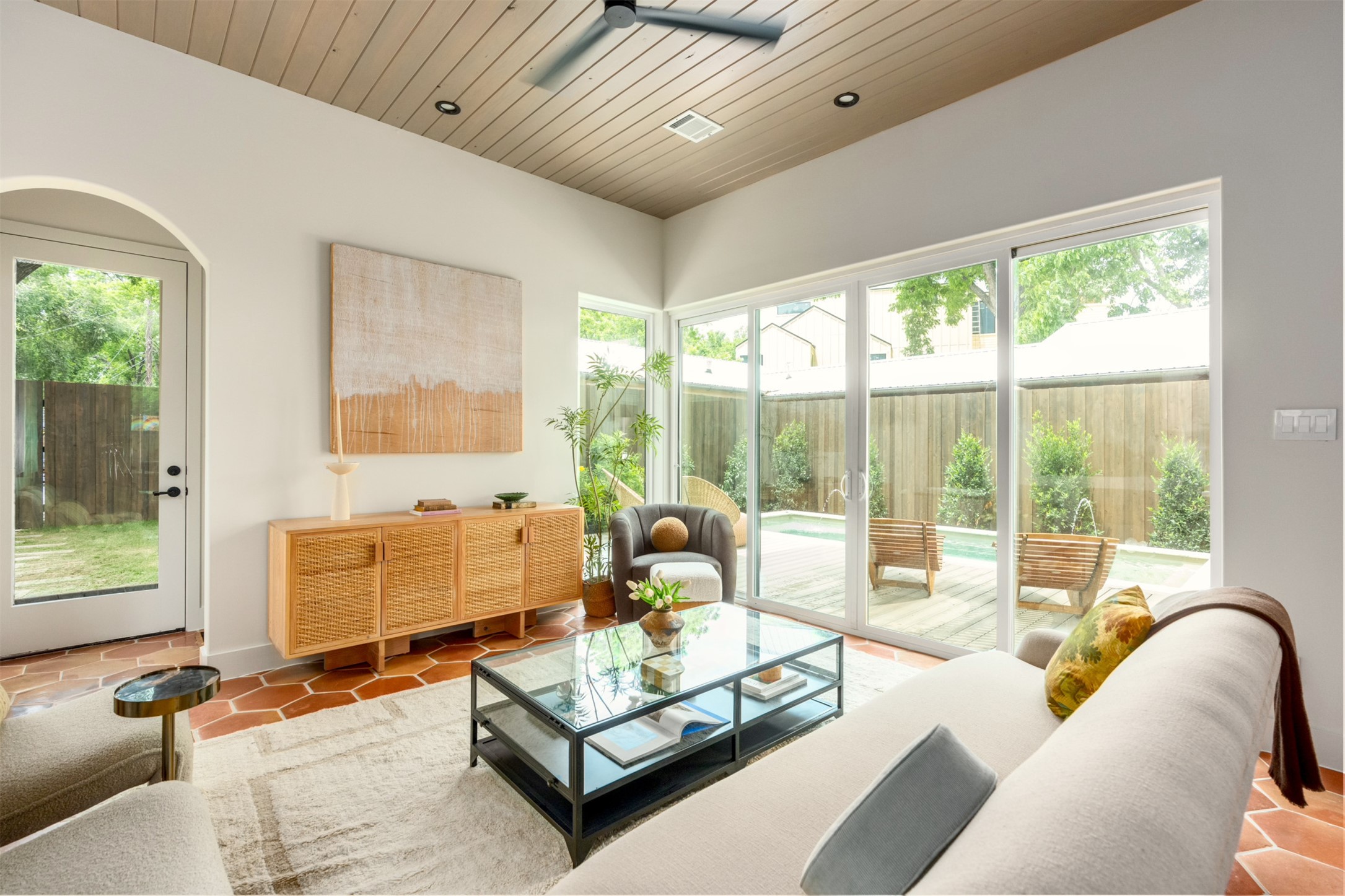 4713 Bolm Road Austin, TX 78702 - Photo 15 of 40 Living area featuring terracotta-style floor tiles, a wood-paneled ceiling, recessed lighting, and a modern ceiling fan