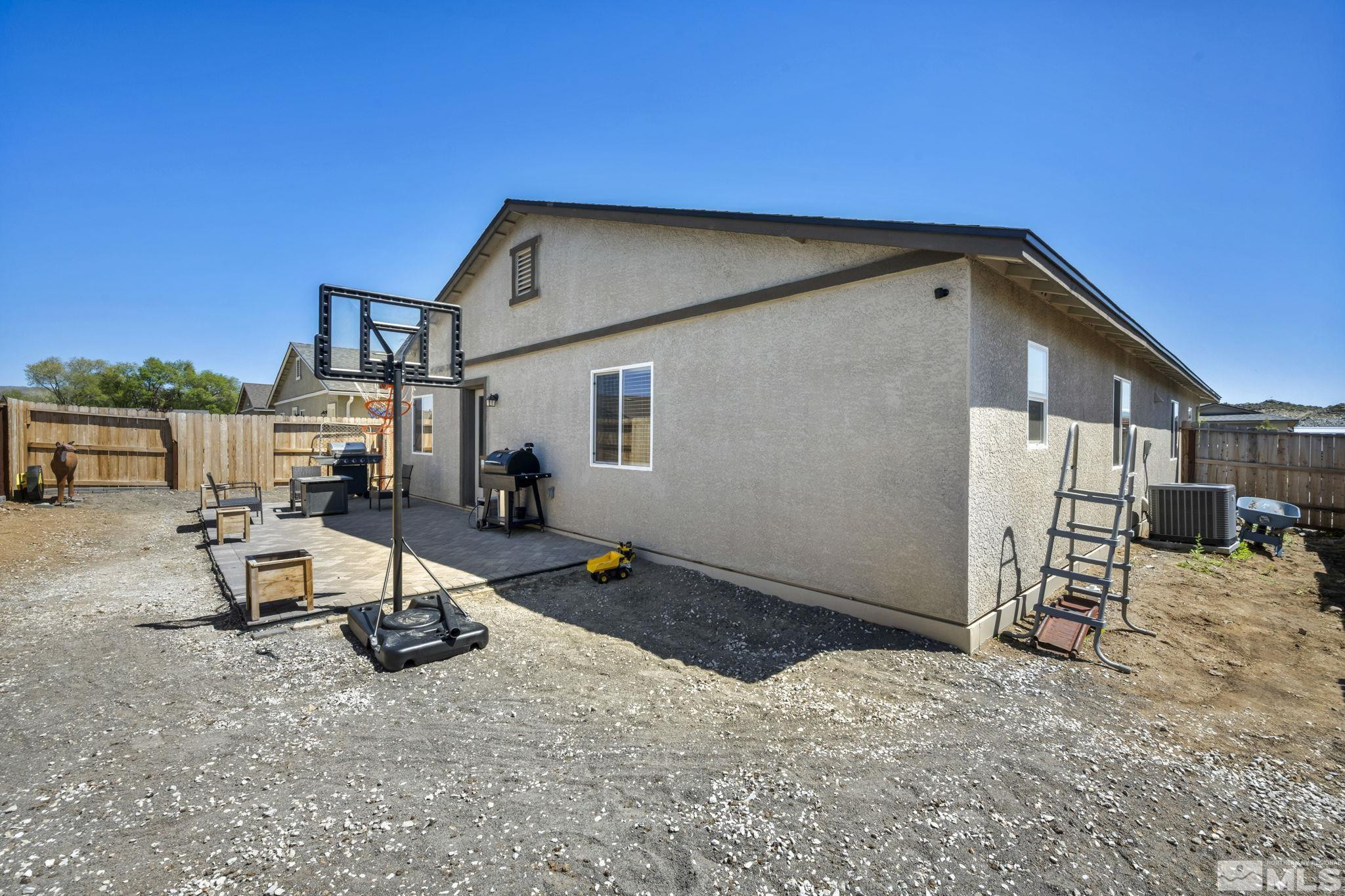 623 Yerington Drive Reno, NV 89506 - Photo 11 of 40 a backyard of a house with table and chairs
