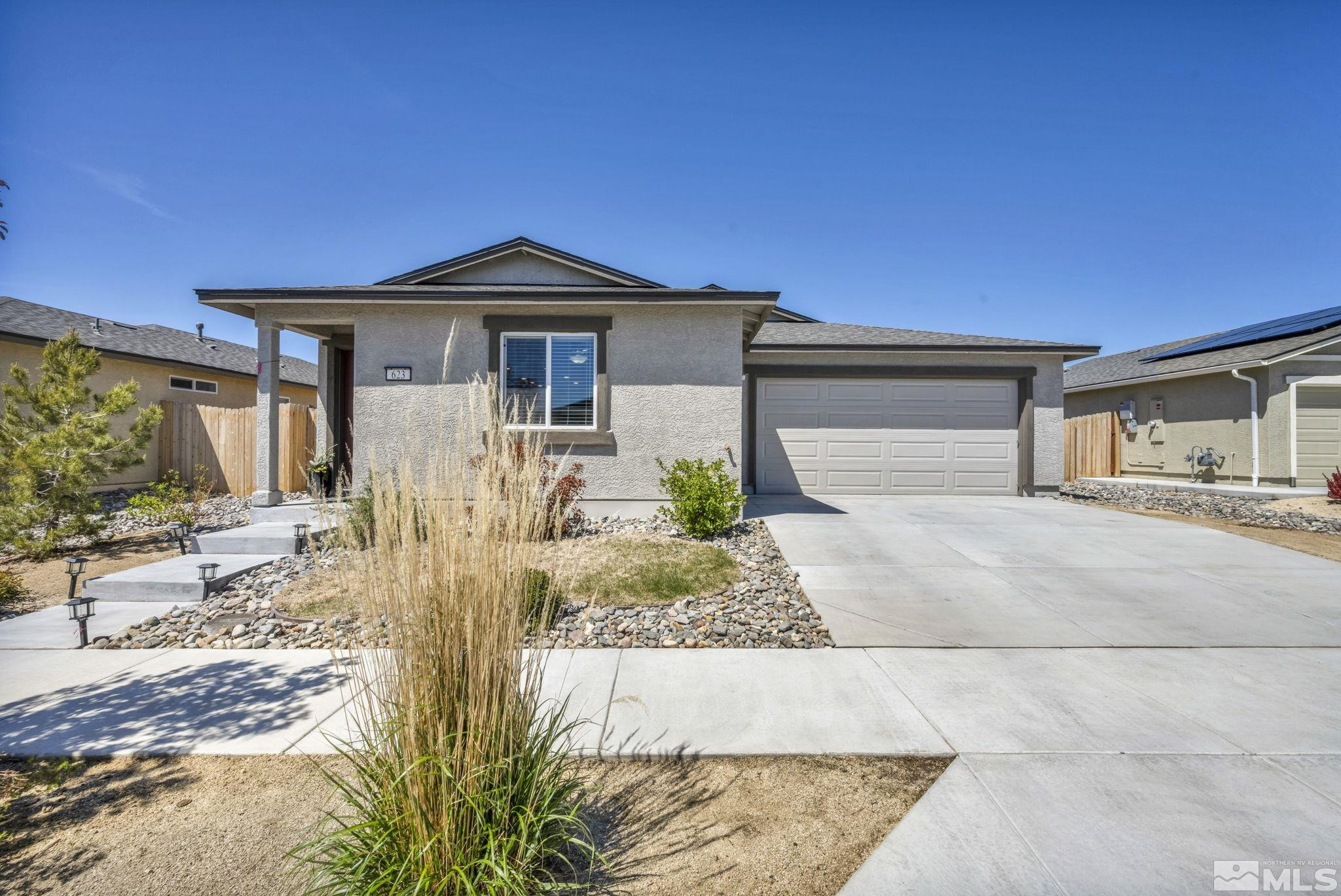 623 Yerington Drive Reno, NV 89506 - Photo 12 of 40 a front view of a house with garden