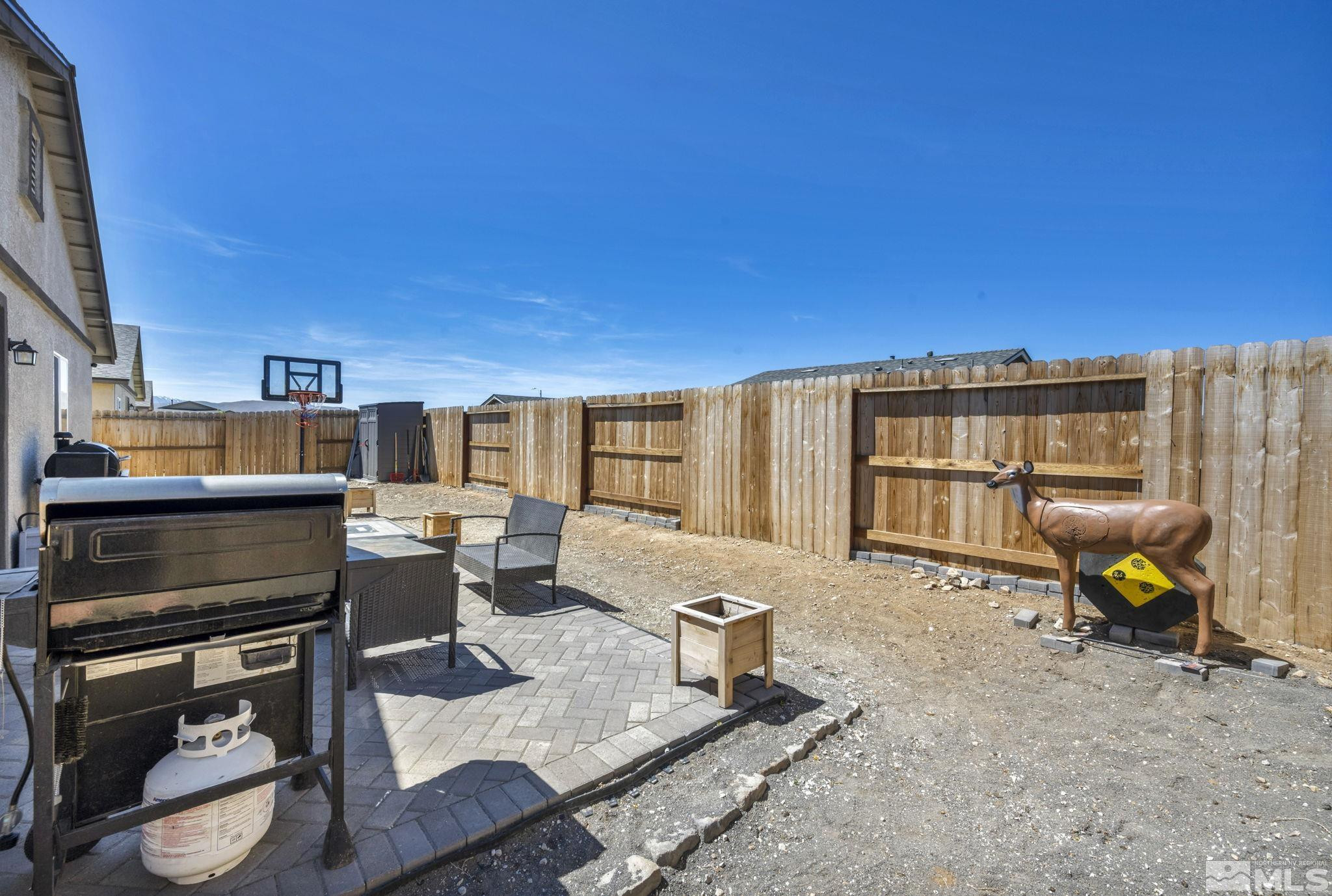 623 Yerington Drive Reno, NV 89506 - Photo 15 of 40 a living room with furniture a fireplace and a flat screen tv