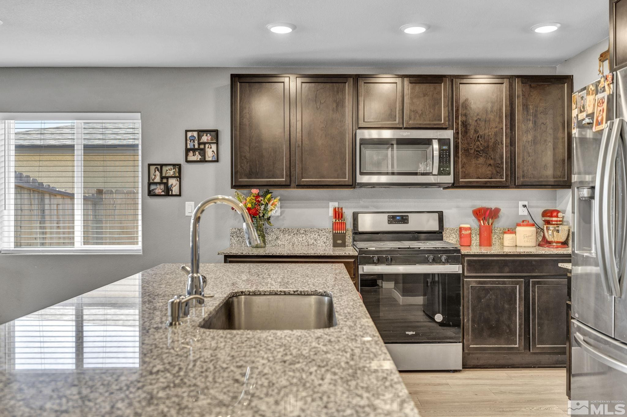623 Yerington Drive Reno, NV 89506 - Photo 2 of 40 a kitchen with stainless steel appliances granite countertop a sink and cabinets