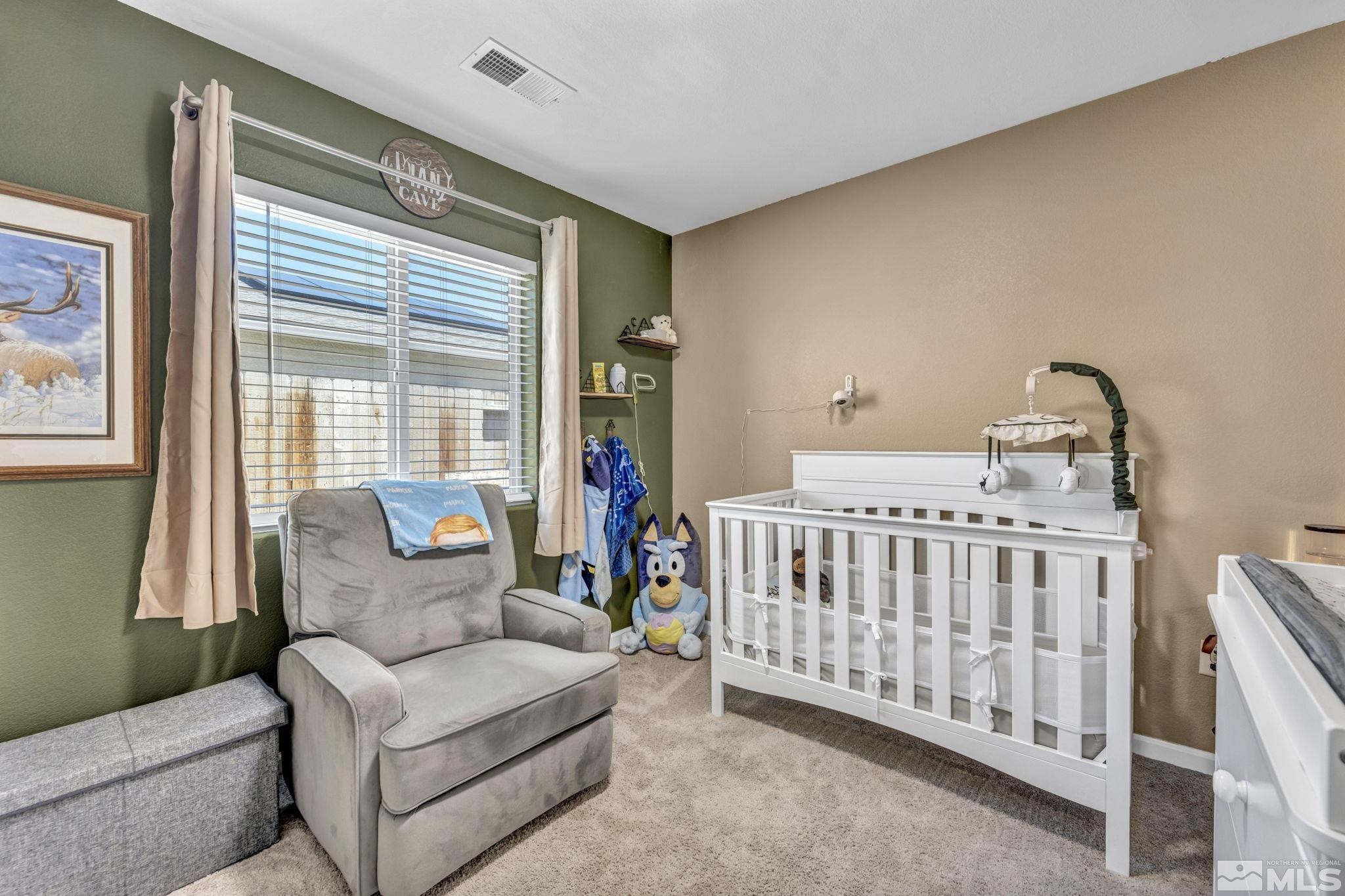 623 Yerington Drive Reno, NV 89506 - Photo 28 of 40 a bedroom with furniture and a large window