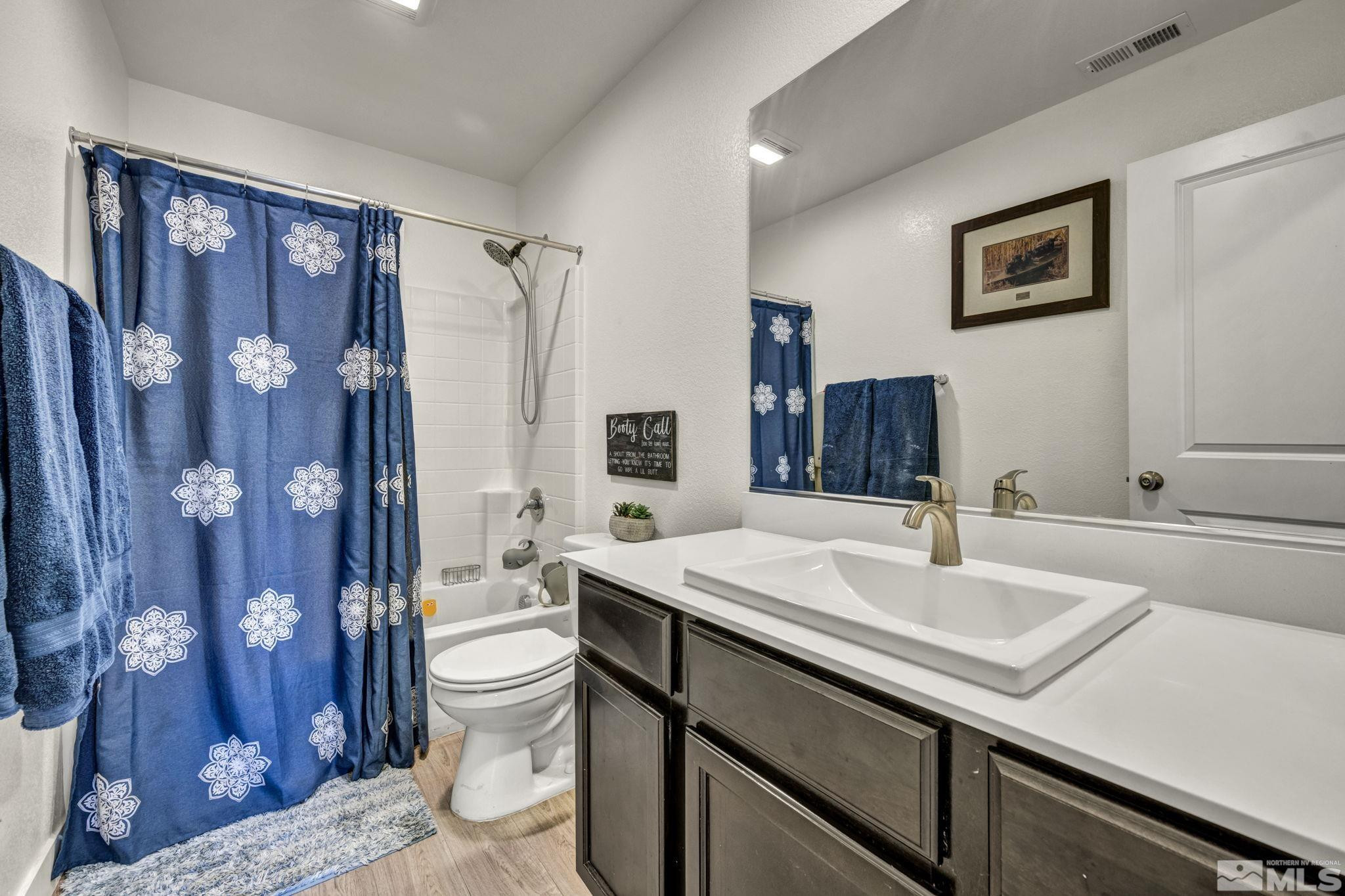 623 Yerington Drive Reno, NV 89506 - Photo 30 of 40 a bathroom with a sink a toilet and shower