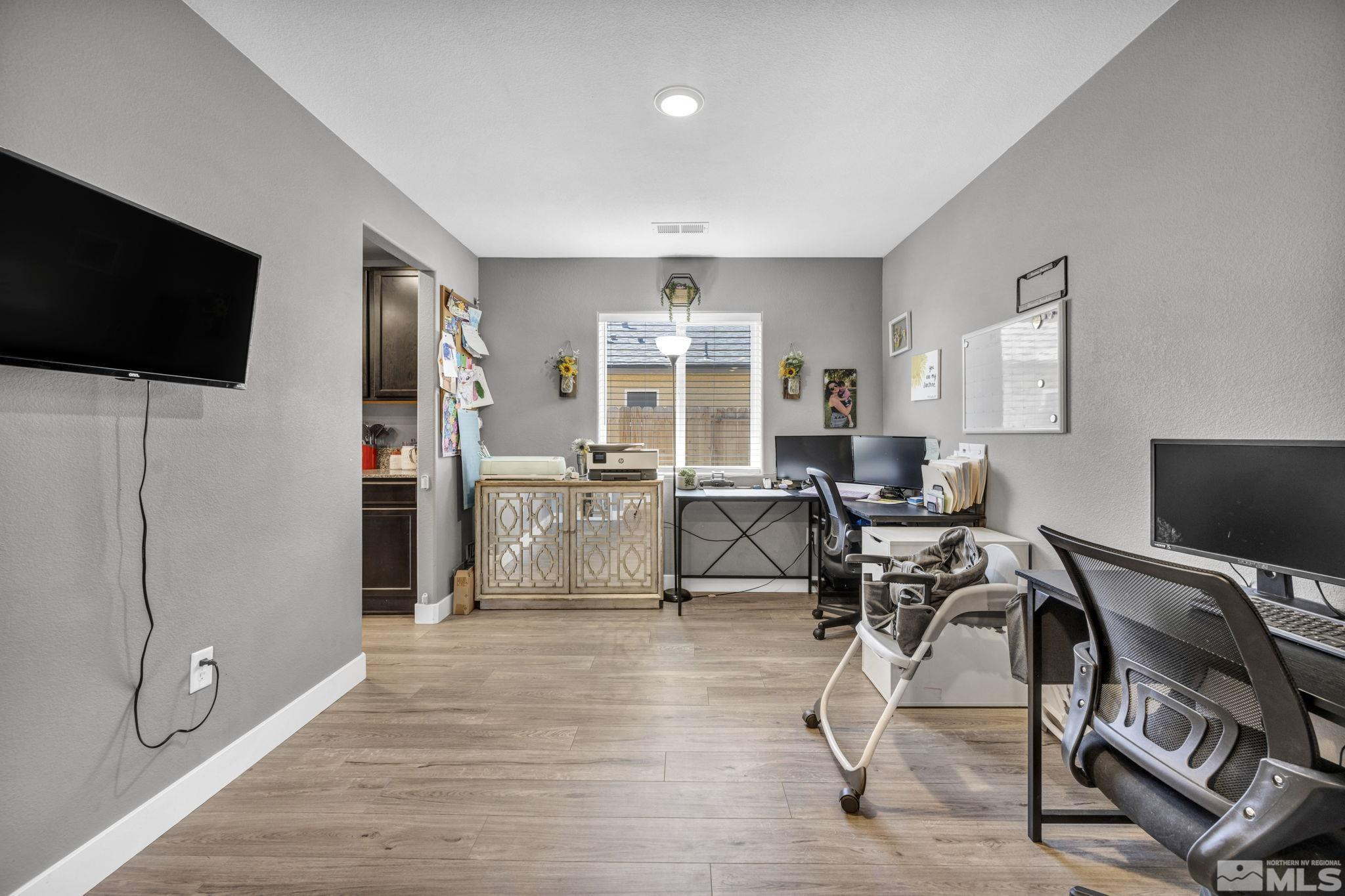 623 Yerington Drive Reno, NV 89506 - Photo 9 of 40 a view of a livingroom with workspace and a window