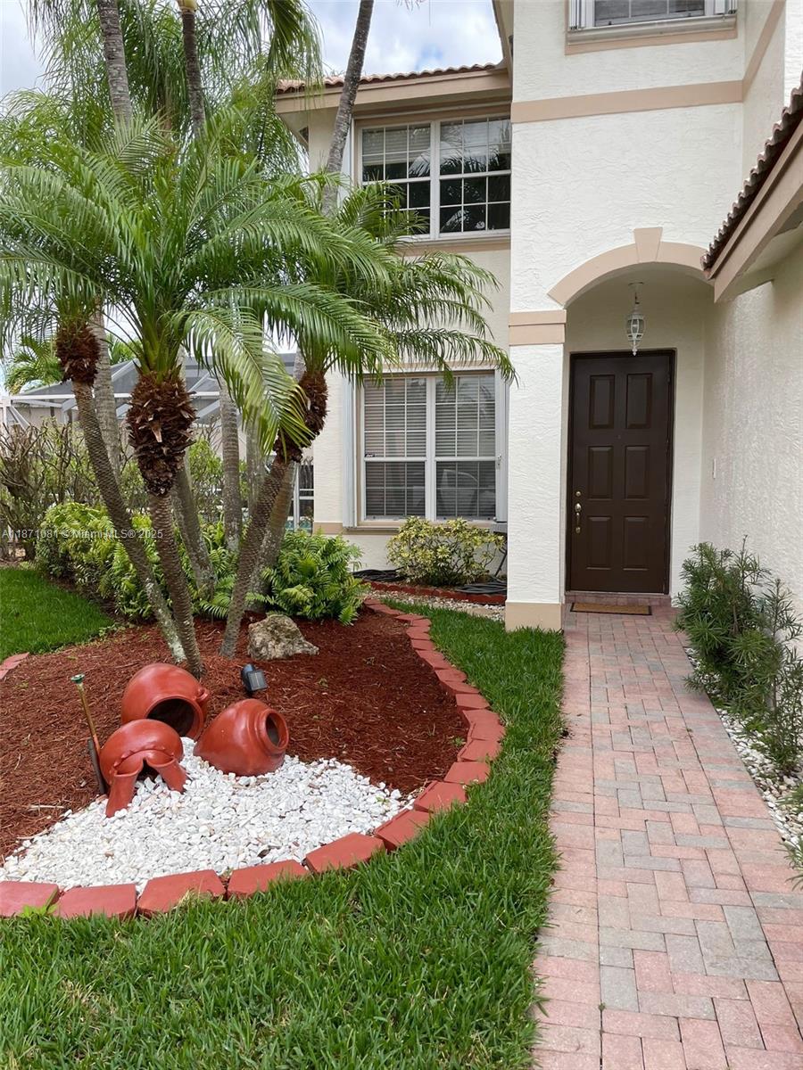 2145 Southwest 150th Avenue Miramar, FL 33027 - Photo 36 of 36 a front view of a house with a yard