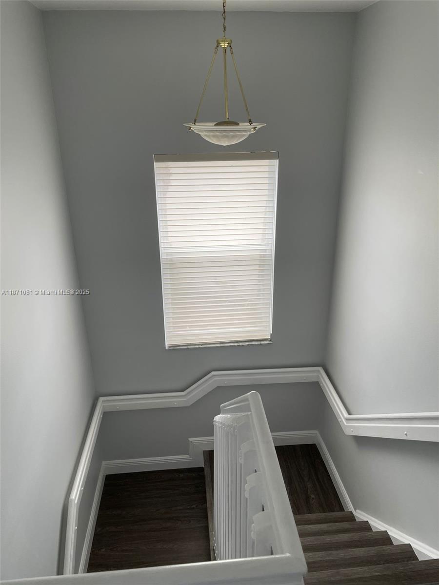 2145 Southwest 150th Avenue Miramar, FL 33027 - Photo 7 of 36 a view of empty room with a fireplace and windows