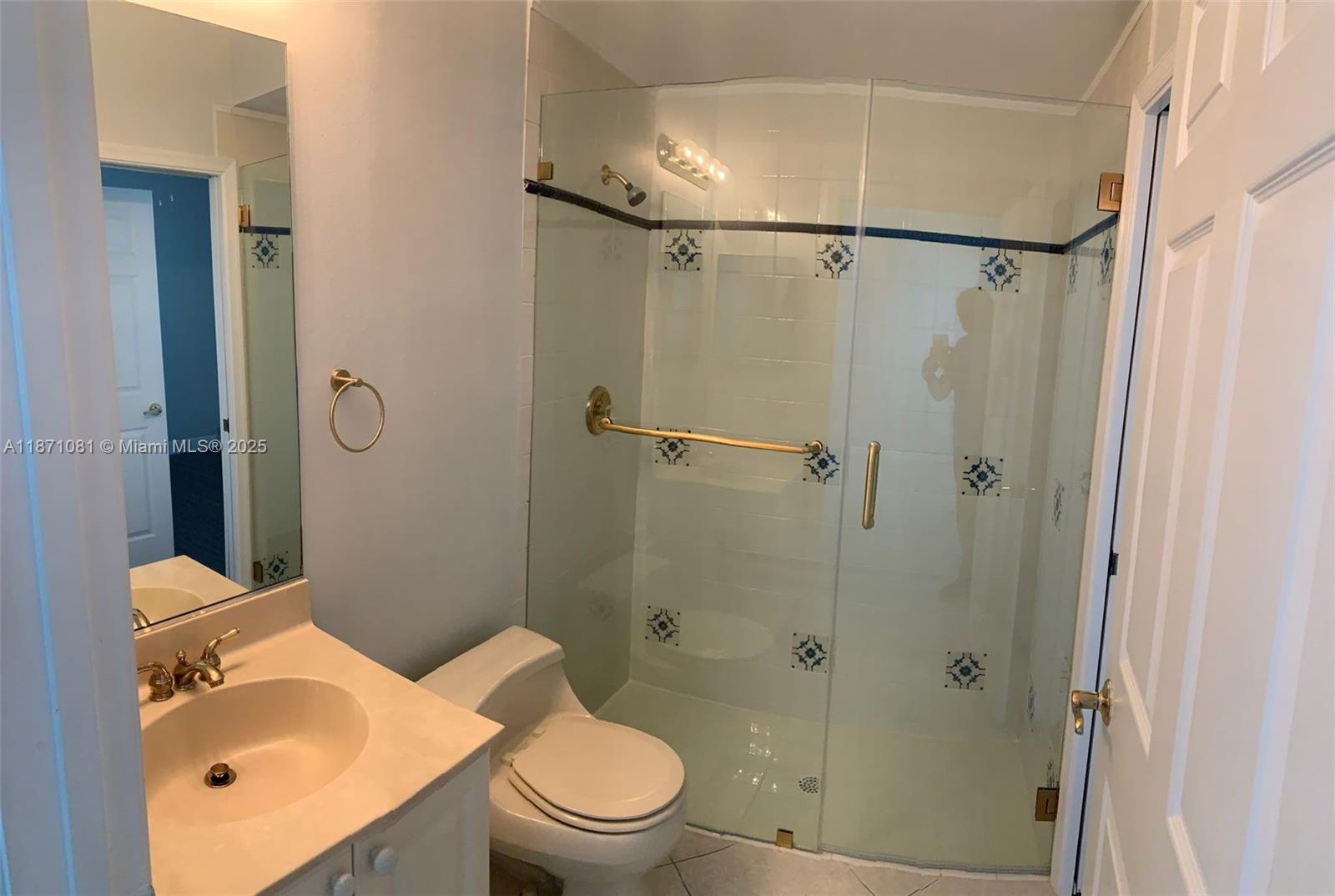 2145 Southwest 150th Avenue Miramar, FL 33027 - Photo 9 of 36 a white toilet sitting next to a bathroom sink