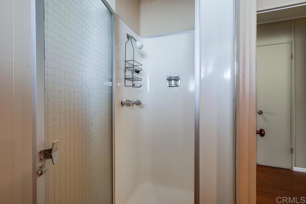 4993 Old Cliffs Road San Diego, CA 92120 - Photo 12 of 20 a bathroom with a shower