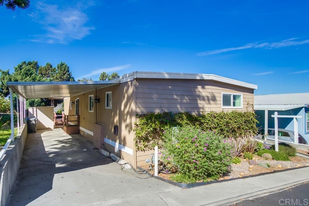 4993 Old Cliffs Road San Diego, CA 92120 - Photo 3 of 20 front view of a house with a yard
