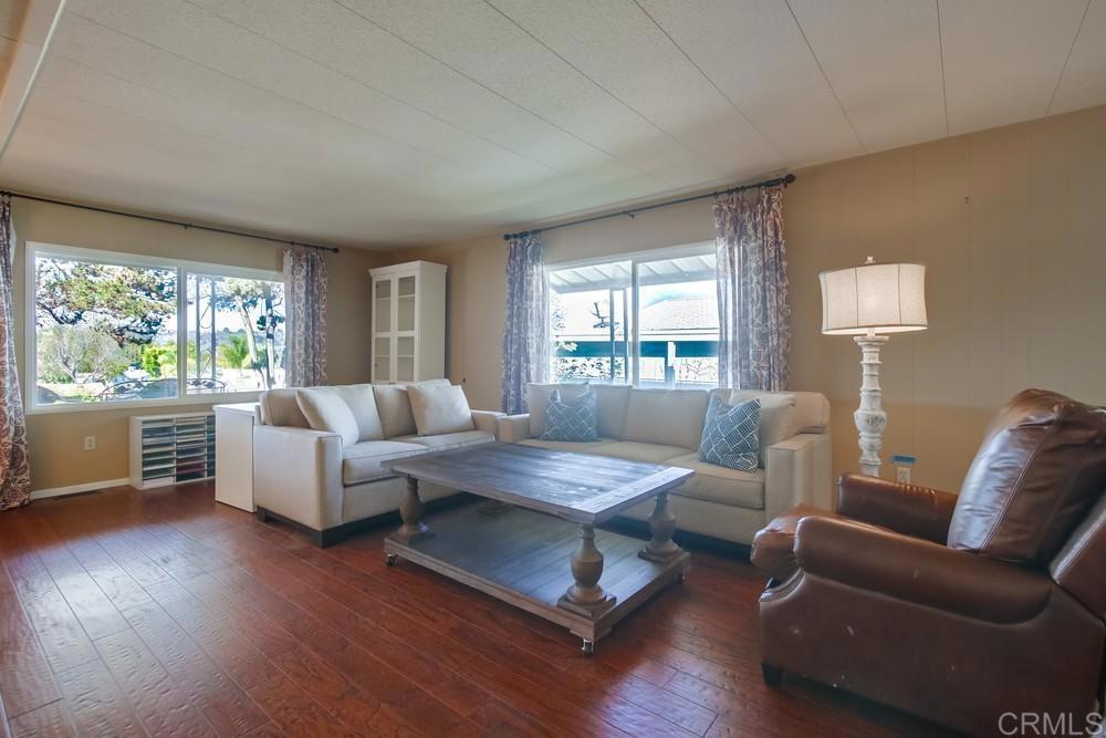 4993 Old Cliffs Road San Diego, CA 92120 - Photo 7 of 20 a living room with furniture and a large window