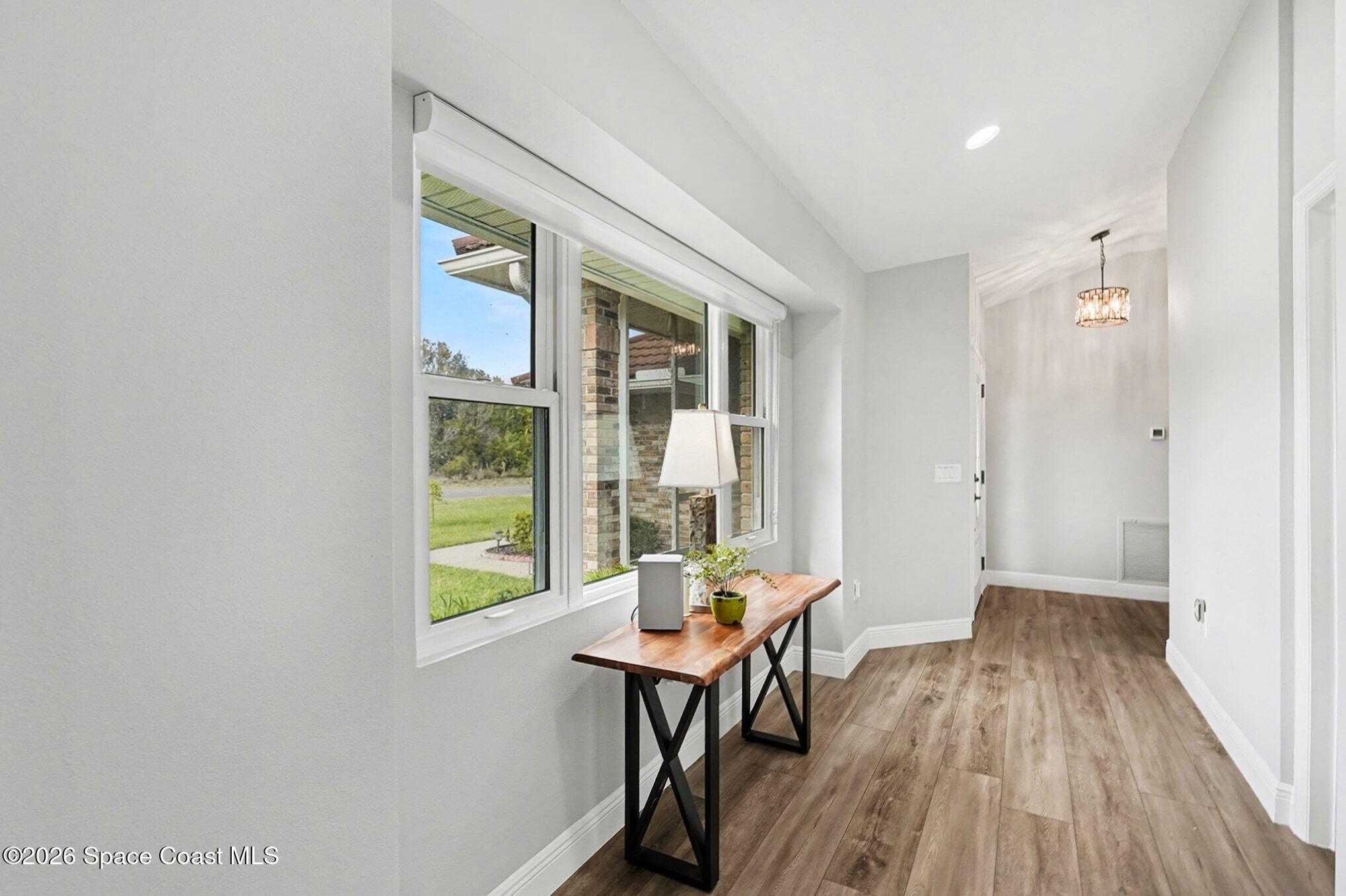 355 Lake View Lane Palm Bay, FL 32909 - Photo 15 of 49 a view of a livingroom with furniture window and wooden floor