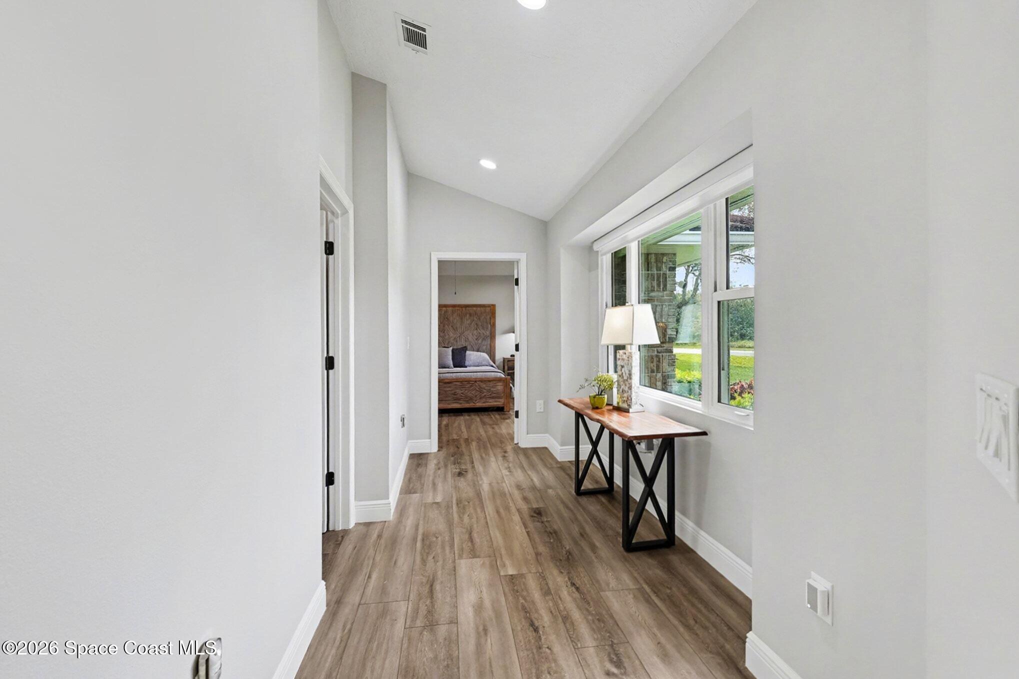 355 Lake View Lane Palm Bay, FL 32909 - Photo 16 of 49 a view of a kitchen with a table and chairs