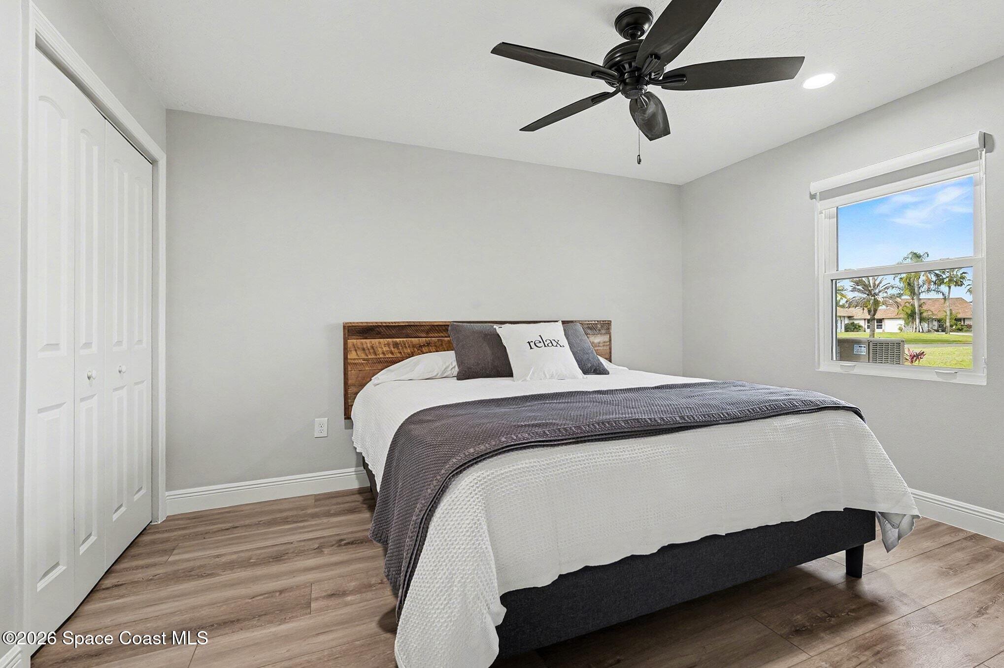 355 Lake View Lane Palm Bay, FL 32909 - Photo 22 of 49 a bedroom with a bed and a window