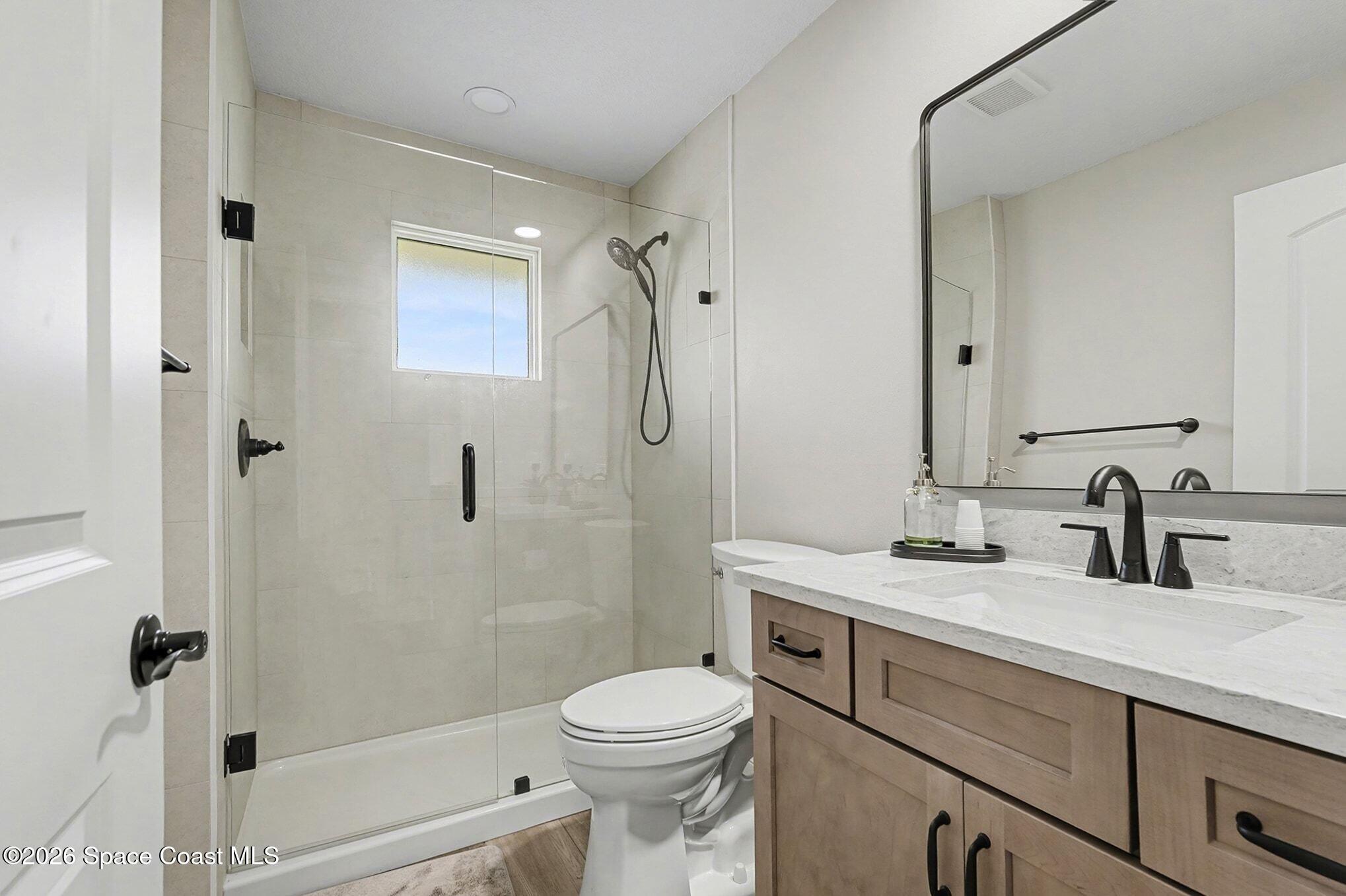 355 Lake View Lane Palm Bay, FL 32909 - Photo 26 of 49 a bathroom with a sink toilet and shower