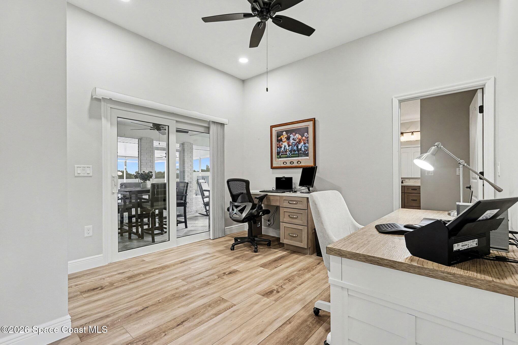 355 Lake View Lane Palm Bay, FL 32909 - Photo 28 of 49 a room with furniture and wooden floor