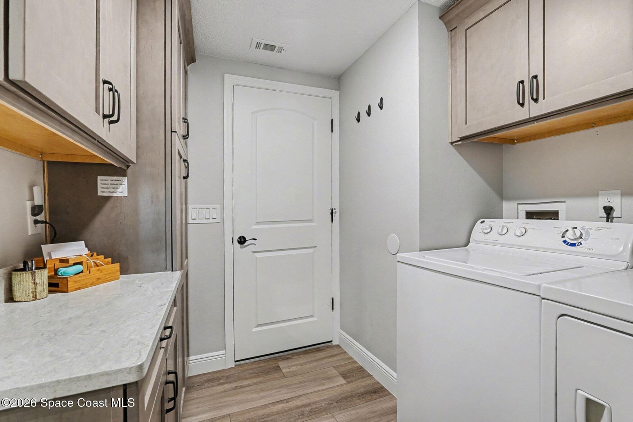 355 Lake View Lane Palm Bay, FL 32909 - Photo 29 of 49 a storage room with washer and dryer
