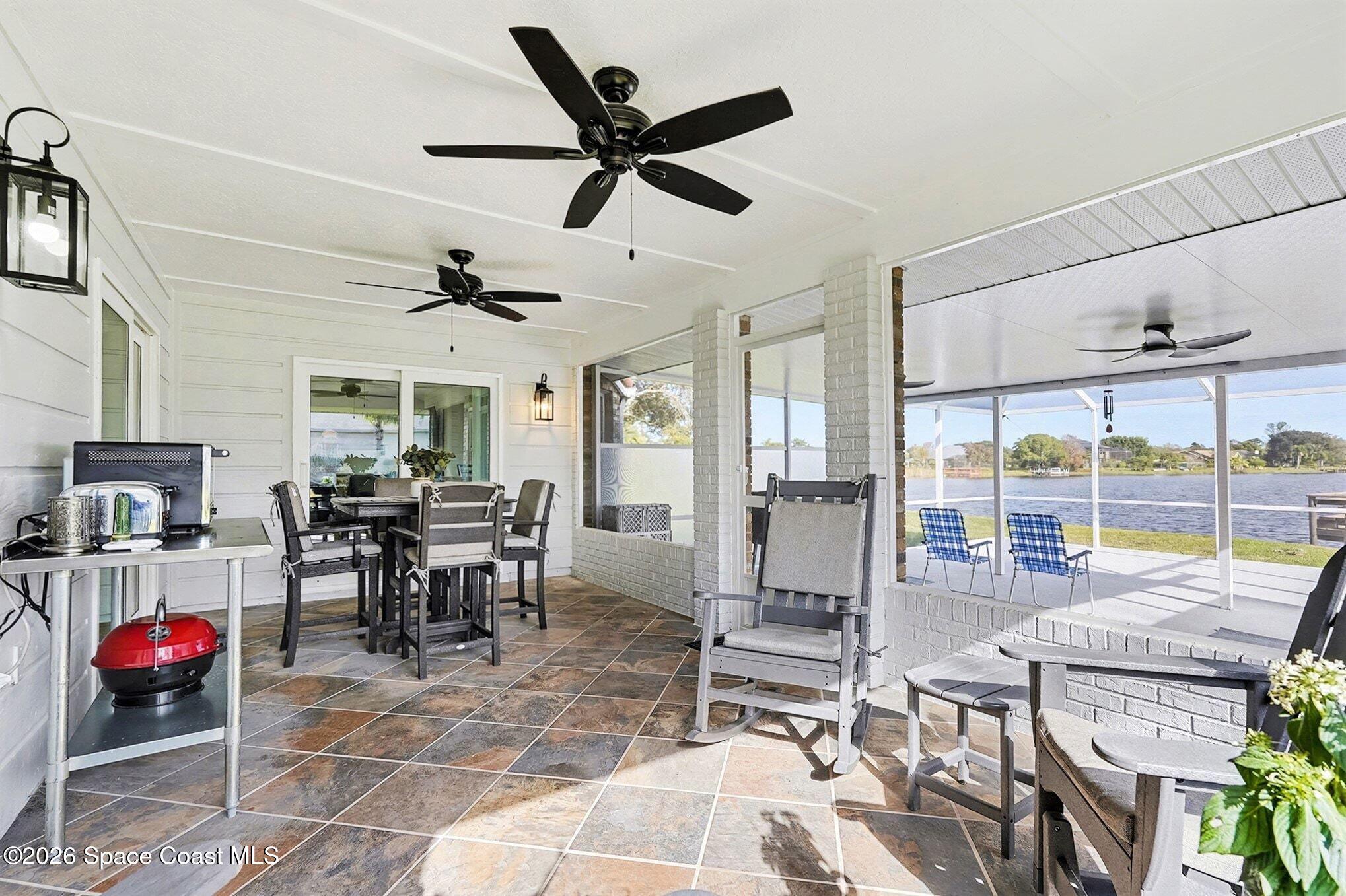 355 Lake View Lane Palm Bay, FL 32909 - Photo 30 of 49 a living room with lots of furniture and window