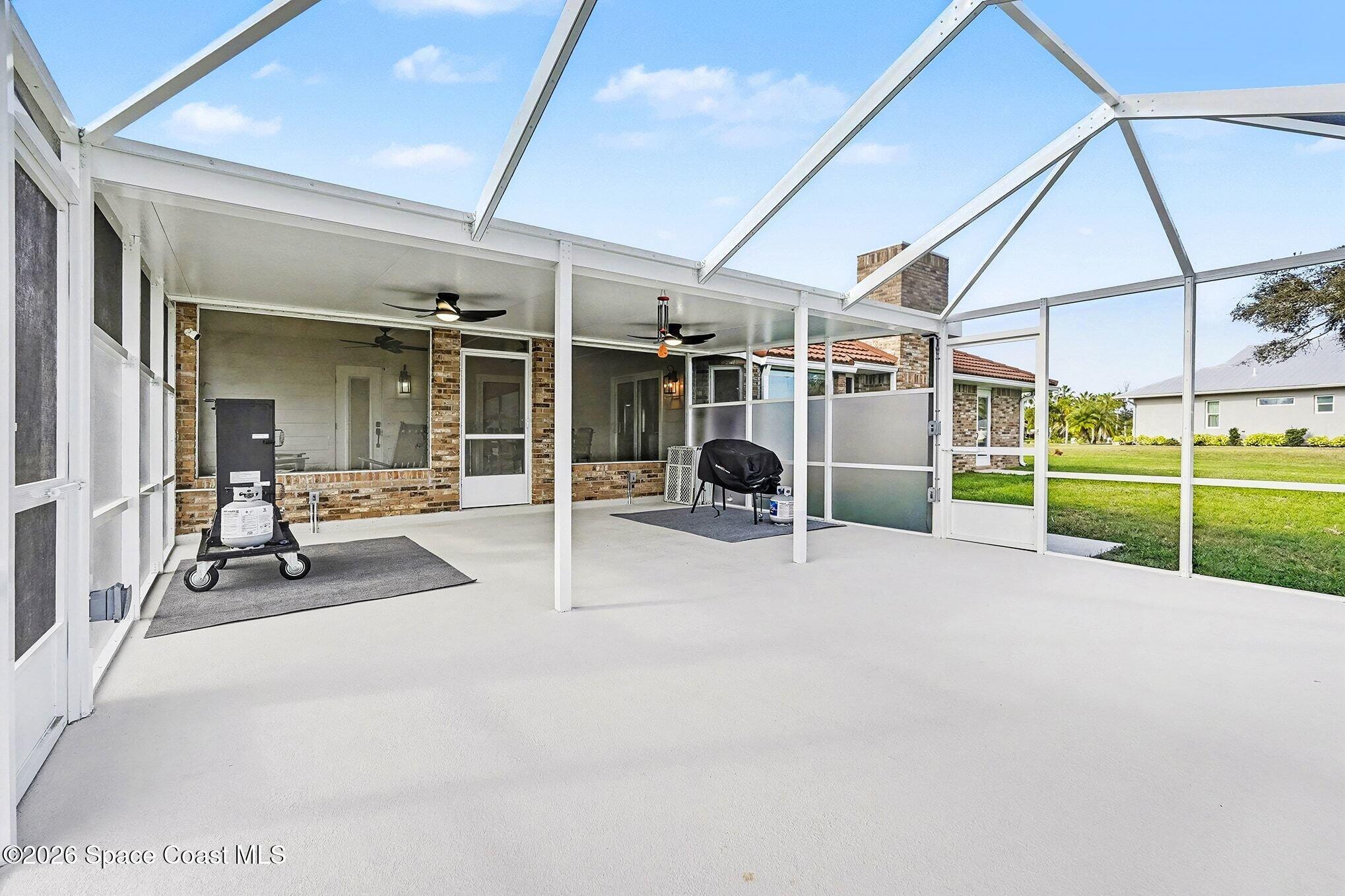 355 Lake View Lane Palm Bay, FL 32909 - Photo 33 of 49 a view of a house with backyard and porch