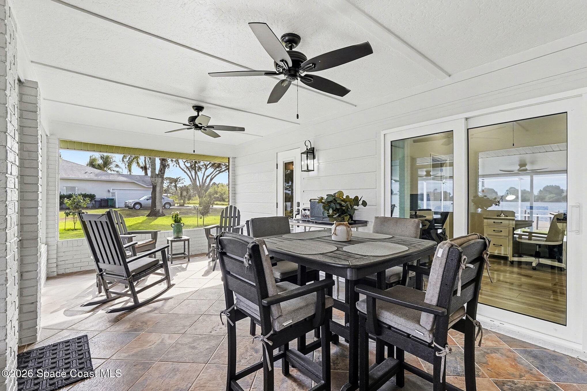 355 Lake View Lane Palm Bay, FL 32909 - Photo 34 of 49 a view of a dining room with furniture window and outside view