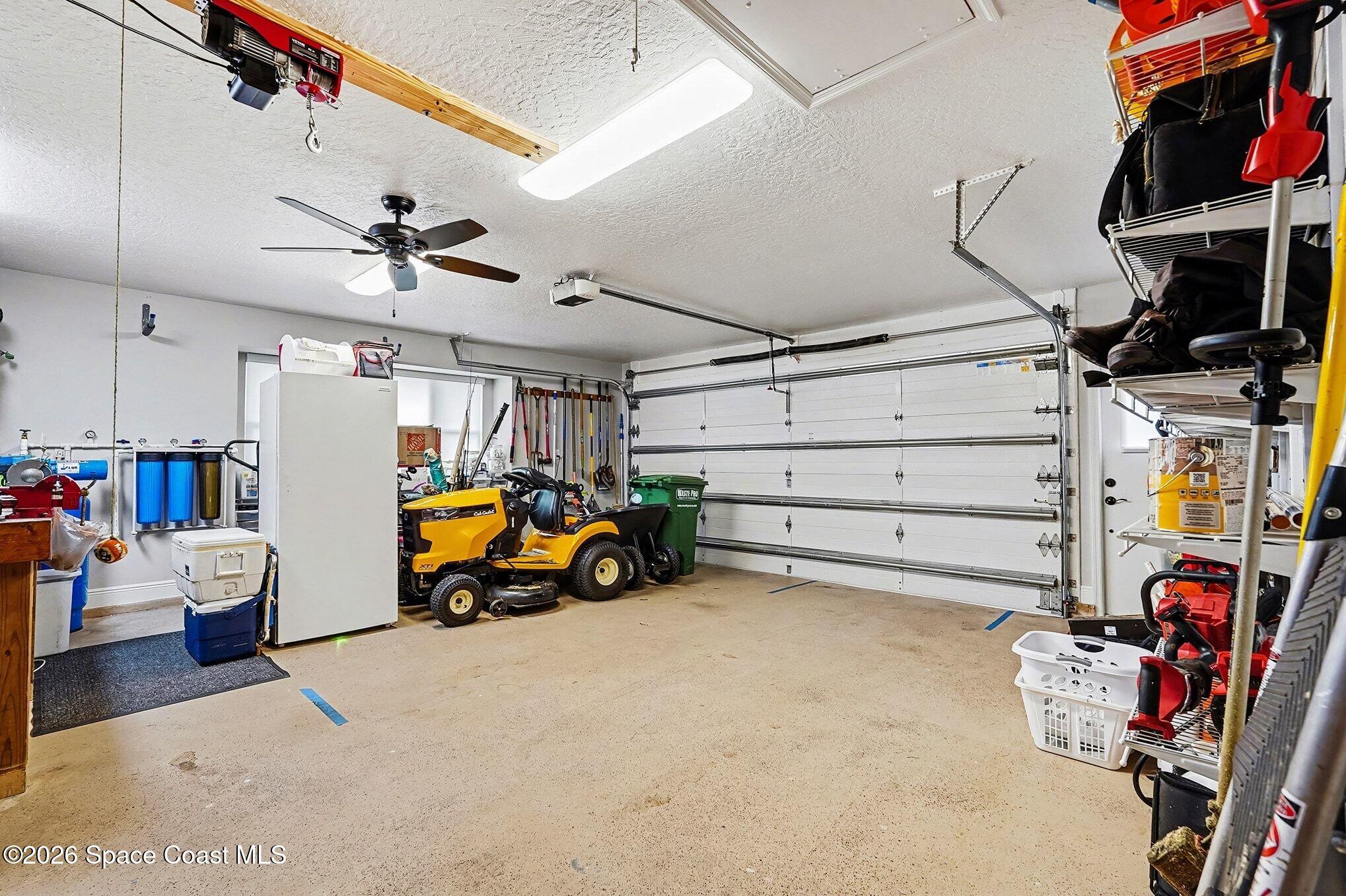 355 Lake View Lane Palm Bay, FL 32909 - Photo 35 of 49 a view of a garage with storage
