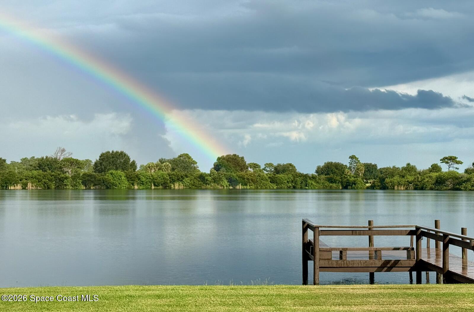 355 Lake View Lane Palm Bay, FL 32909 - Photo 47 of 49 a view of a lake with houses in the back