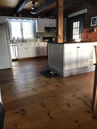 106 Paddock Road Rutland, MA 01543 - Photo 3 of 16 a large white kitchen with a large window