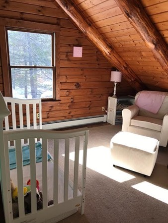 106 Paddock Road Rutland, MA 01543 - Photo 7 of 16 a view of a porch with wooden floor and outdoor seating