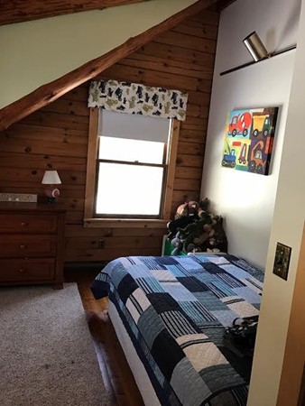 106 Paddock Road Rutland, MA 01543 - Photo 8 of 16 a bed room with a bed window and dresser