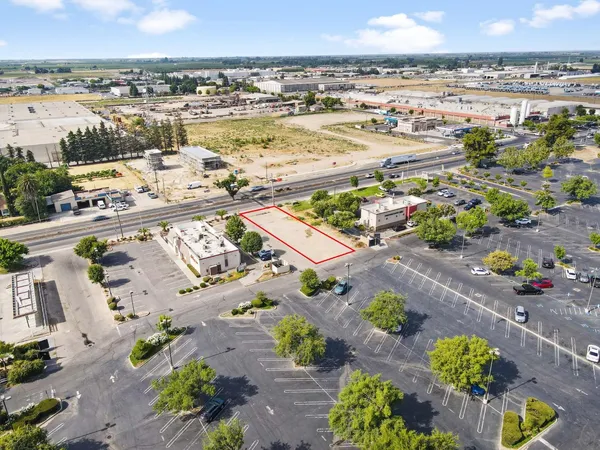 a aerial view of a residential apartment building with swimming pool