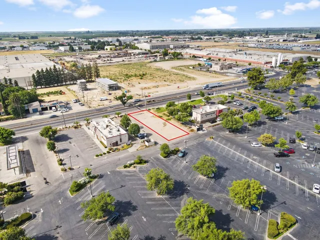 a aerial view of a residential apartment building with swimming pool