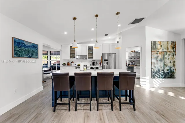 a living room with furniture a rug and a flat screen tv