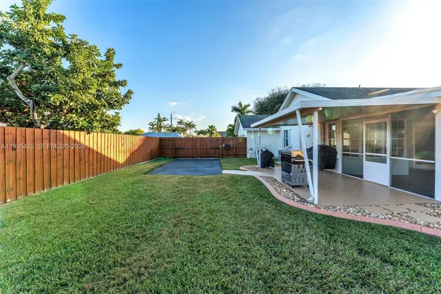 an aerial view of residential building with an ocean
