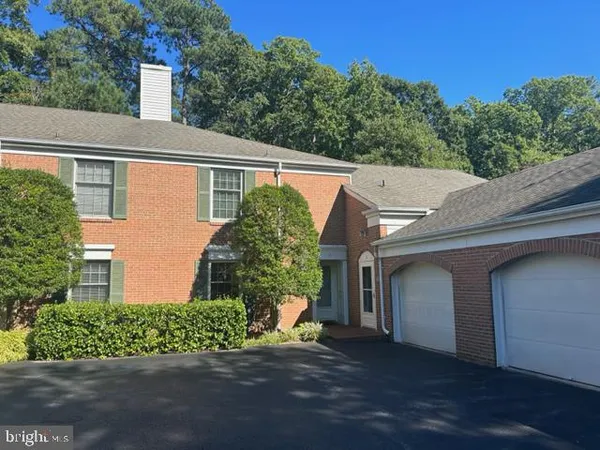a view of a house with a yard and plants