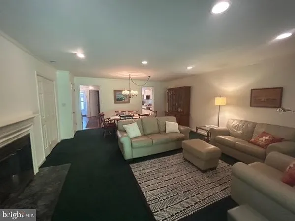 a living room with furniture and a rug