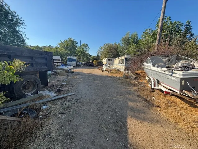 a view of a backyard with sitting area