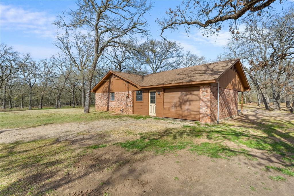 1447 Red Gate Road Mart, TX 76664 - Photo 18 of 38 a view of a house with a yard