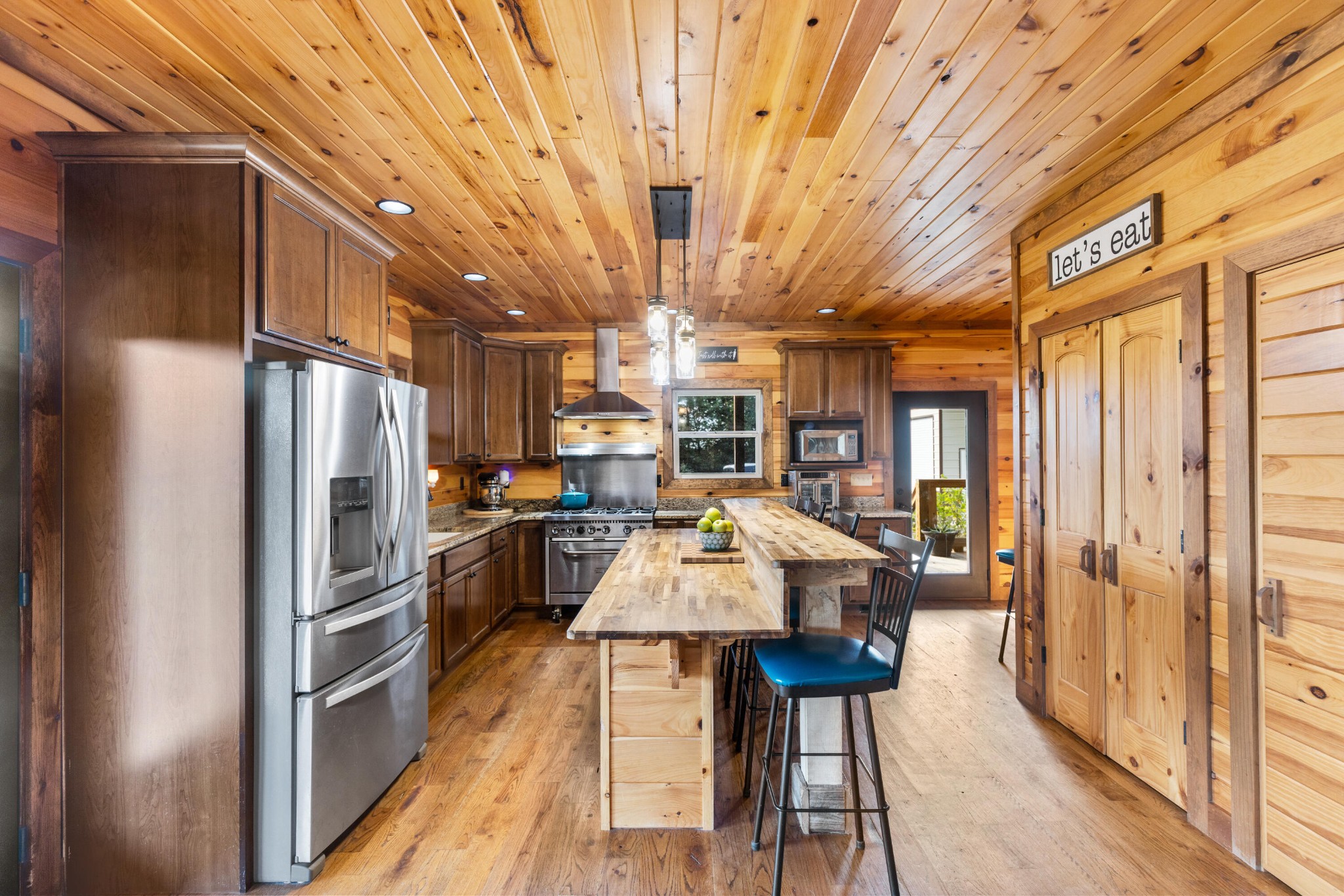 2054 Horns Creek Road Ocoee, TN 37361 - Photo 16 of 42 a kitchen with stainless steel appliances granite countertop a refrigerator a stove and a wooden floors