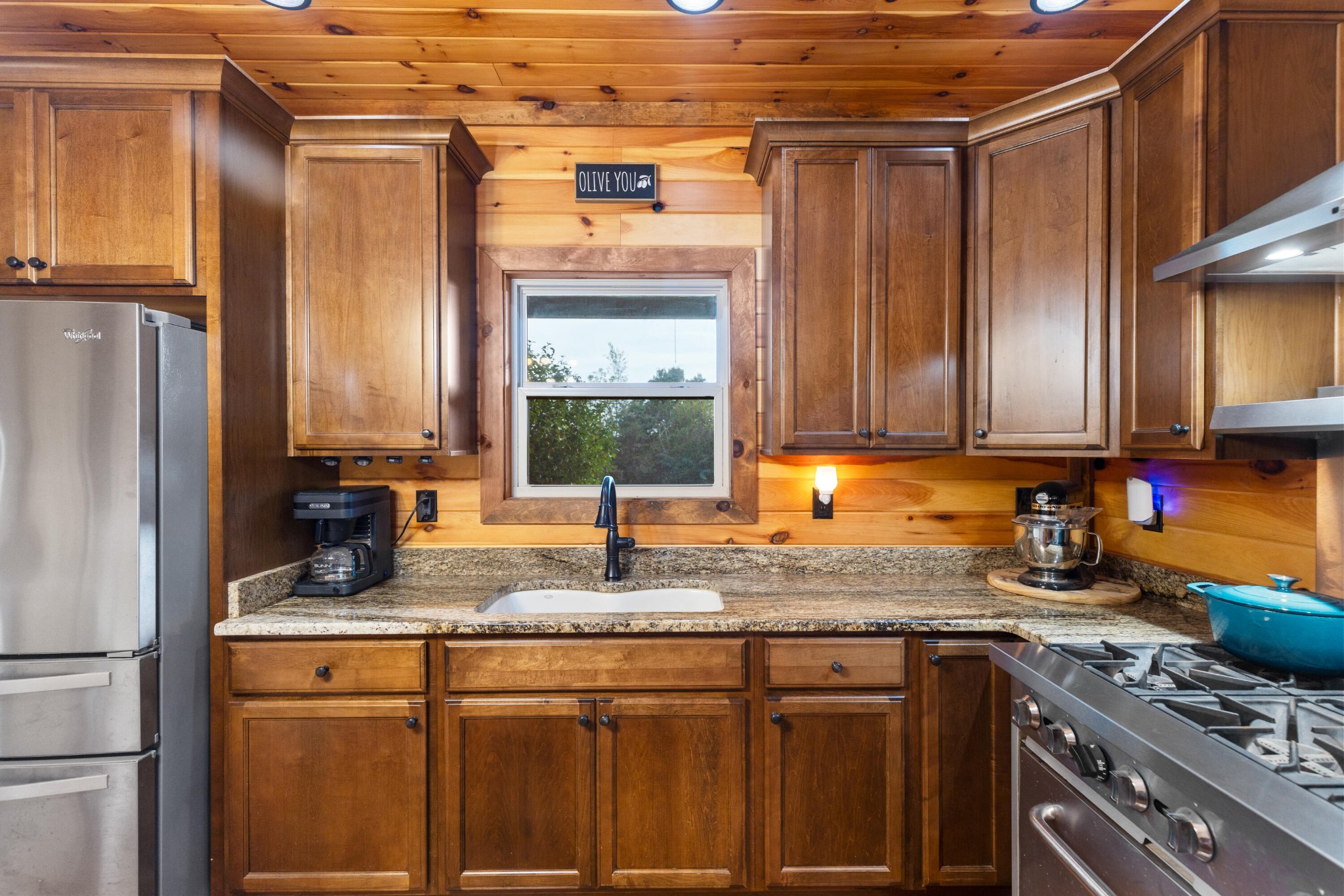 2054 Horns Creek Road Ocoee, TN 37361 - Photo 18 of 42 a kitchen with stainless steel appliances granite countertop a sink stove and refrigerator