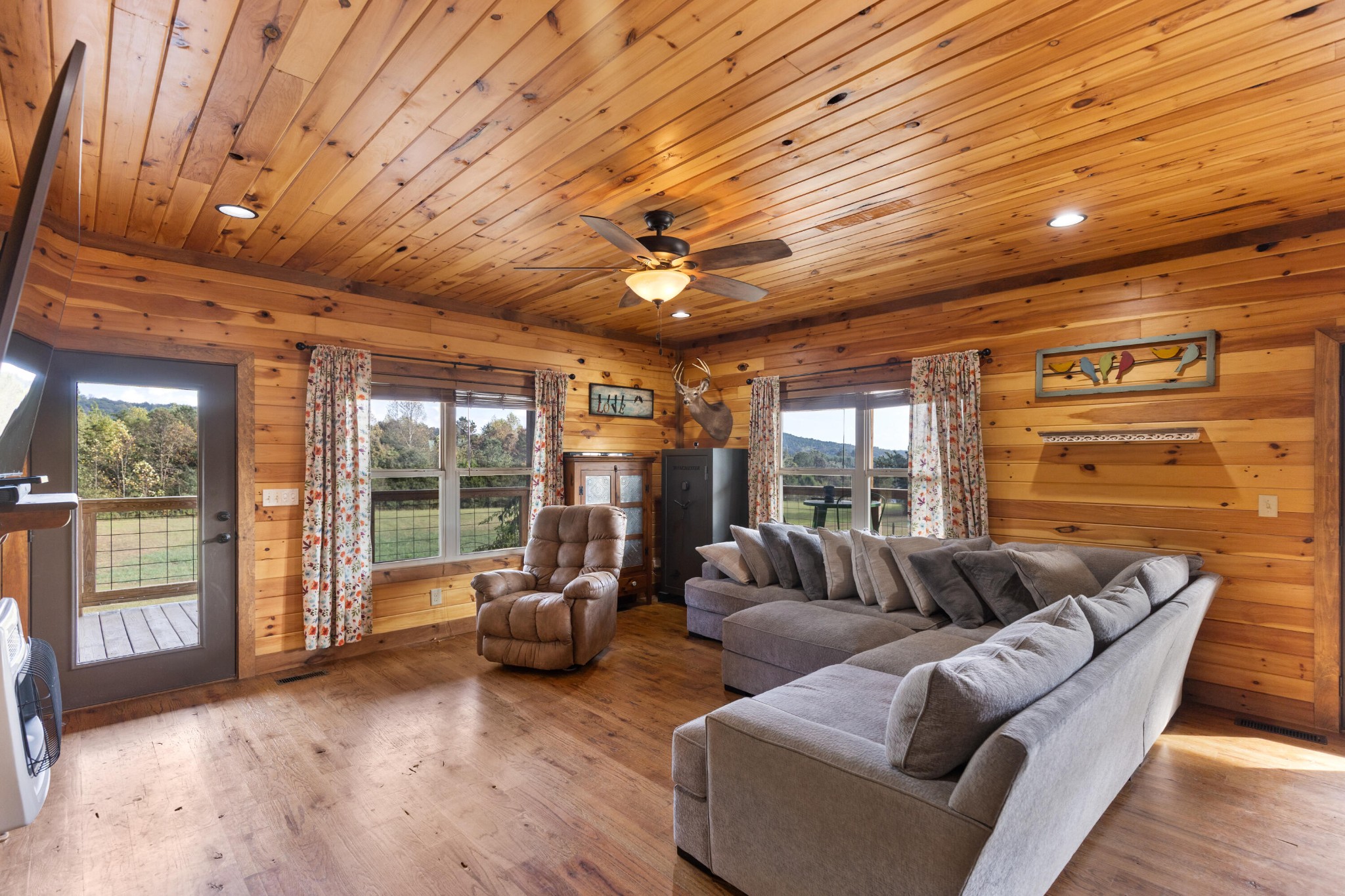 2054 Horns Creek Road Ocoee, TN 37361 - Photo 19 of 42 a living room with furniture a ceiling fan and a large window