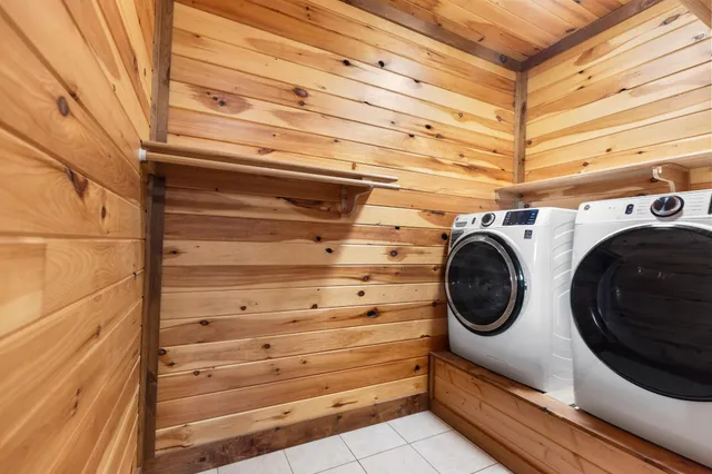 a bathroom with a granite countertop sink toilet and a mirror