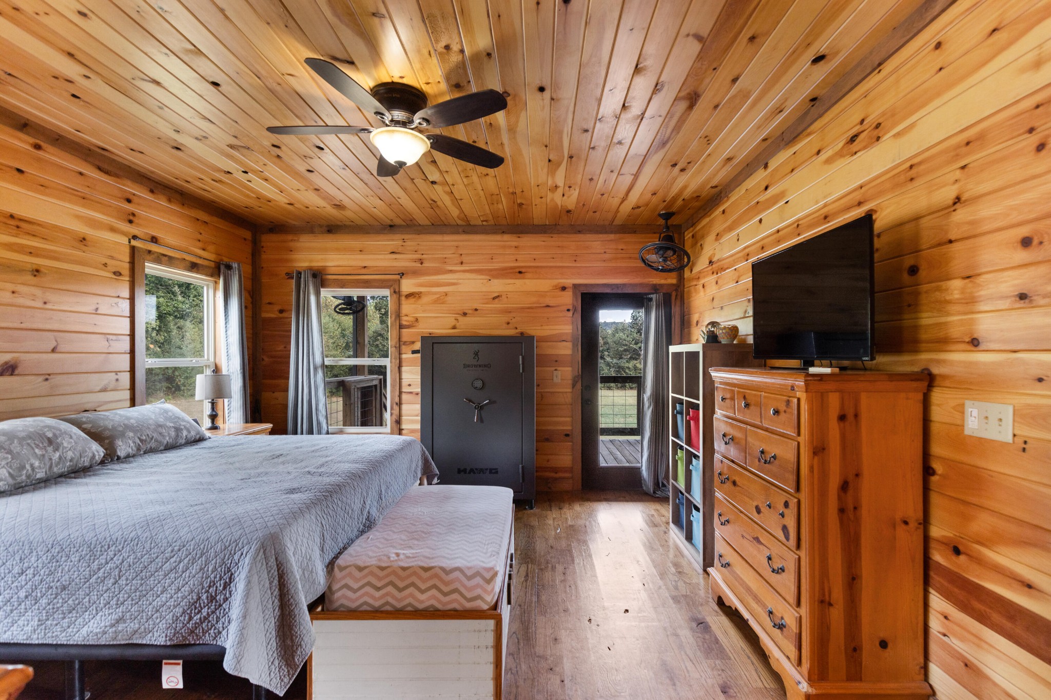 2054 Horns Creek Road Ocoee, TN 37361 - Photo 25 of 42 a bedroom with furniture and a flat screen tv