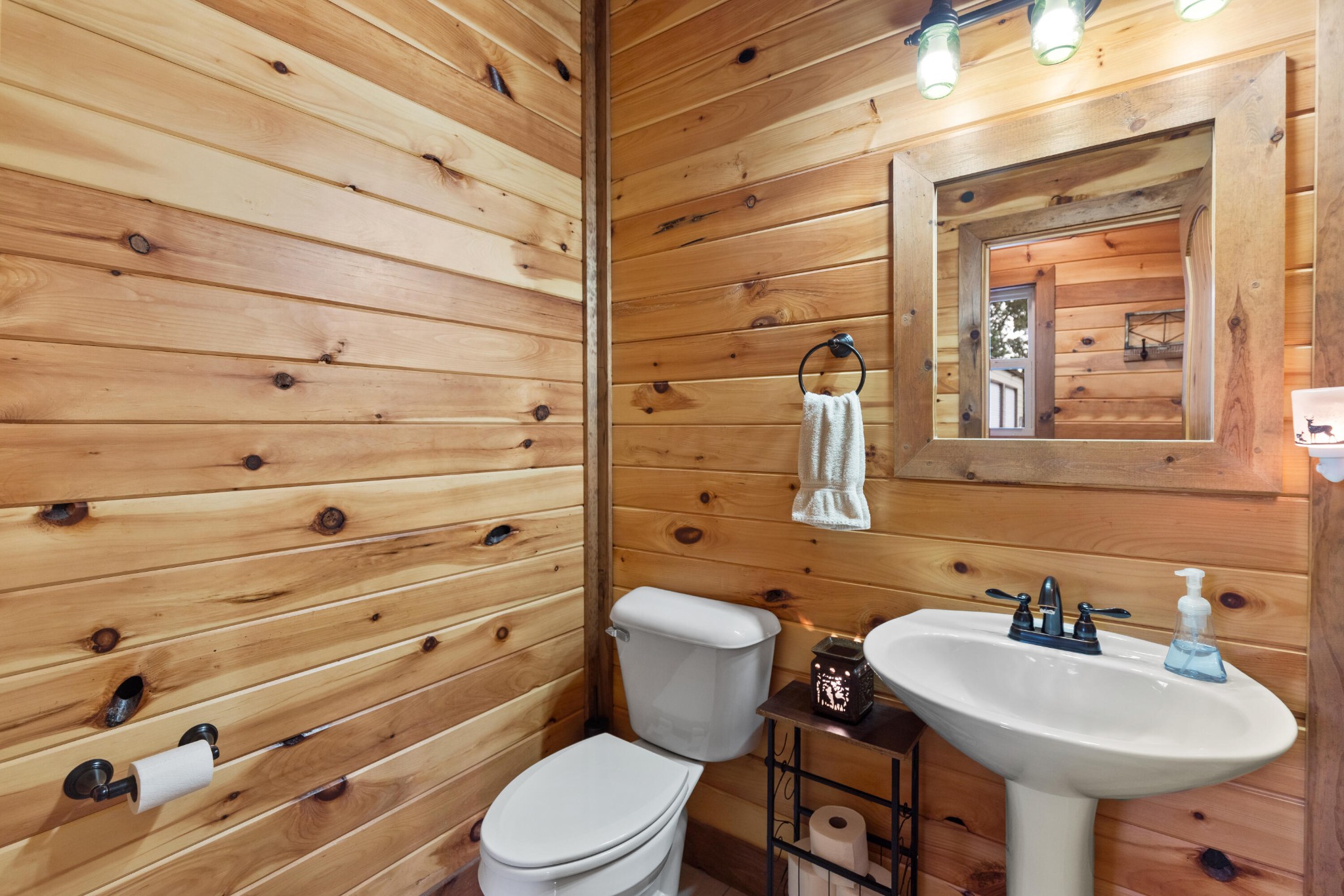 2054 Horns Creek Road Ocoee, TN 37361 - Photo 31 of 42 a bathroom with a toilet a sink and mirror