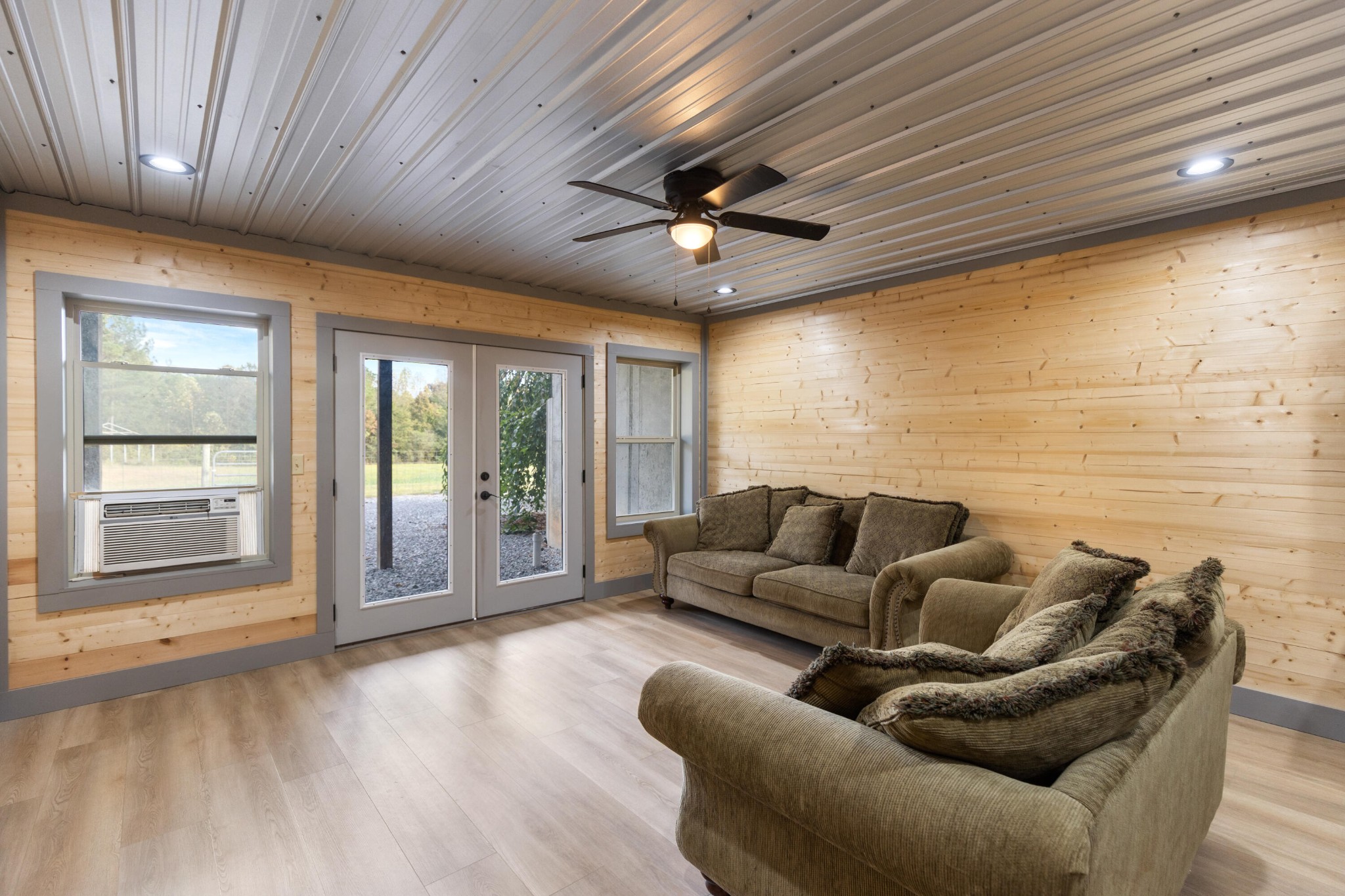 2054 Horns Creek Road Ocoee, TN 37361 - Photo 38 of 42 a living room with furniture floor to ceiling window and a flat screen tv