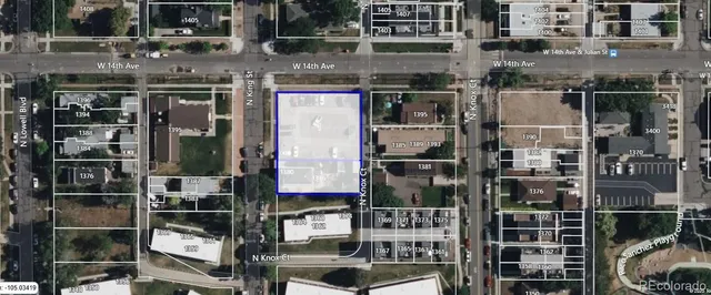 a picture of a street with retail shops