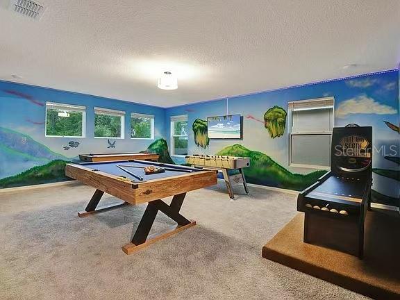 1919 Tropical Palms Circle Kissimmee, FL 34747 - Photo 22 of 41 a living room with furniture pool table and a window