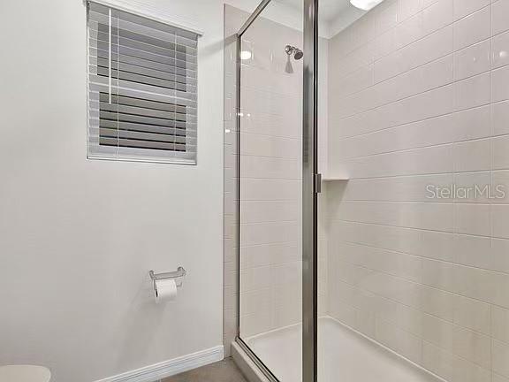 1919 Tropical Palms Circle Kissimmee, FL 34747 - Photo 24 of 41 a bathroom with a window