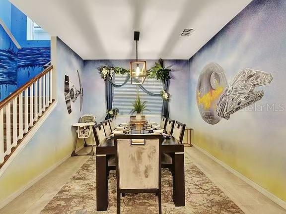1919 Tropical Palms Circle Kissimmee, FL 34747 - Photo 26 of 41 a view of dining area with chandelier
