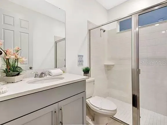 a bathroom with a sink double vanity and a mirror