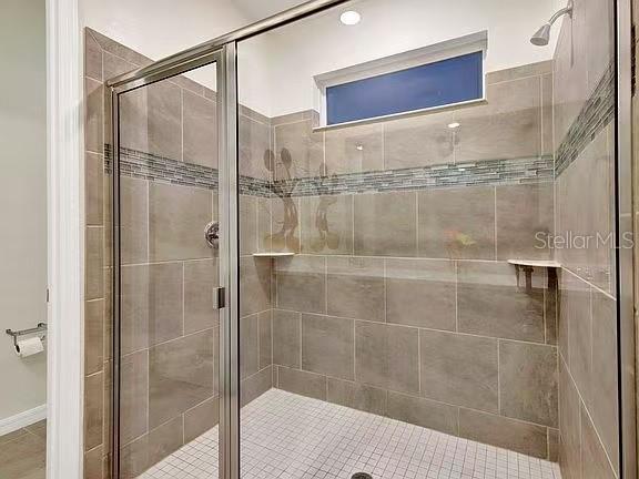 1919 Tropical Palms Circle Kissimmee, FL 34747 - Photo 29 of 41 a bathroom with a shower